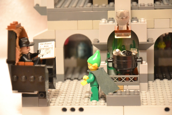 LEGO MOC - New Year's Brick 2014 - 'В глубине виллы 'Ночной кошмар'...: В кабинете мага стояла семейная реликвия - кресло с высокой спинкой. Четыреста лет тому назад один умелец-вампир - золотые руки, сколотил это кресло из  досок собственного гроба. На обивку была пущена шкура вервольфа – надо заметить, впрочем, что за четыре столетия обивка малость повытерлась. Это кресло Шуткозлобер получил в наследство от предков и обращался с ним необычайно бережно, хотя вообще он был колдуном вполне современным и не отставал от прогресса.