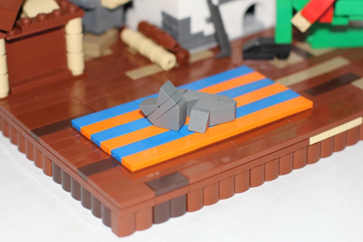 LEGO MOC - Russian Tales' Wonders - Stone Soup (Axe Kasha): На ковре мирно дремлет серый кот. И пусть даже в крестьянских домах петровских времен не было ковров - это же сказка. Здесь все возможно.
