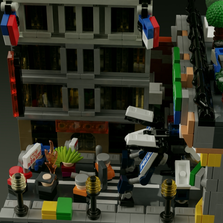 LEGO MOC - 16x16: Micro - Революция человечества. Рассвет и закат Детройта: </center></i><br><br />
Даже в колонне движимых общей целью людей виден разный подход к способам её достижения - в то время, как некоторые из протестующих держат в руках плакаты с лозунгами против вмешательства в естественный процесс революции (один из них, 'stop playin' gods'/'перестаньте изображать из себя богов', весьма красноречиво намекает на это), более отчаянный и отчаявшийся человек в сером капюшоне держит наготове 'коктейль Молотова'. Правда, и меры предосторожности, принятые полицией в отношении небольшой группы, можно счесть лишними.<br />
<i><center>
